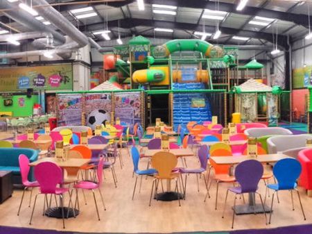 Inside monkey bizness, it shows the seating area and an overview of the soft play