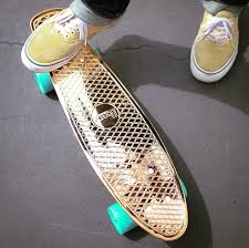 A short skateboard with 1 person with their foot on the skateboard