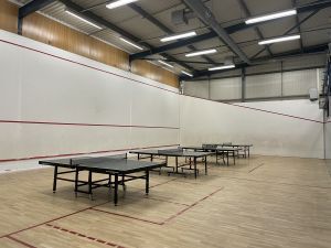 Sports hall with badminton tables.