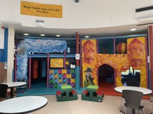Magic Castle Soft Play area for children with adjacent seating.