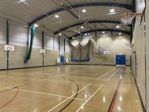 Large, bright sports hall for all activities. Includes basketball hoops and football goals.