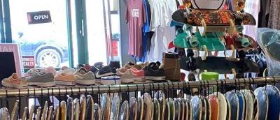 the window of the store which shows the penny boards that they have on offer.