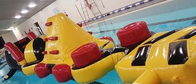 Giant inflatable assault course floating in a pool