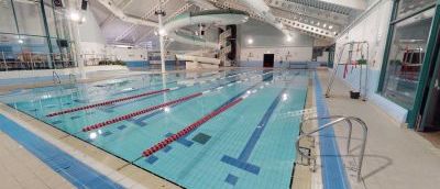 inside Lewes leisure centre pool. It has a pool with lanes in and a long curly slide